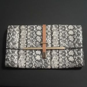 Faux snakeskin clutch.